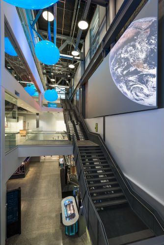 Interactive video wall and colour-changing spheres in the atrium of the Discovery Centre science museum in Halifax, an award-winning AV integration by Backman Vidcom.